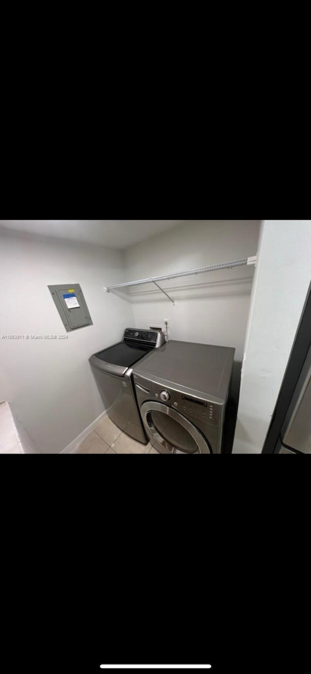 307 Pine Ridge Cir Unit C1, Greenacres, FL 33463 - home office with washing machine and clothes dryer and tile patterned flooring