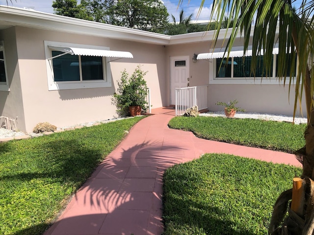 1760 Bel Air Ave, Lauderdale By The Sea, FL 33062 - doorway to property with stucco siding