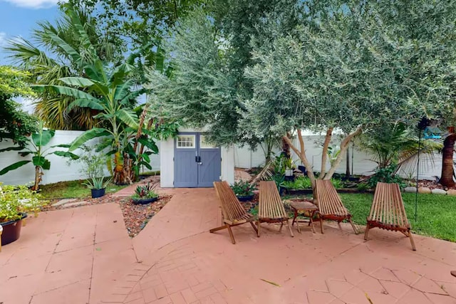 1760 Bel Air Ave, Lauderdale By The Sea, FL 33062 - fenced backyard with a patio area