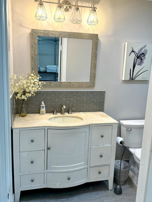 1760 Bel Air Ave, Lauderdale By The Sea, FL 33062 - half bath featuring backsplash, vanity, and wood finished floors