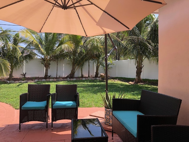 1760 Bel Air Ave, Lauderdale By The Sea, FL 33062 - fenced backyard with a patio area and outdoor lounge area