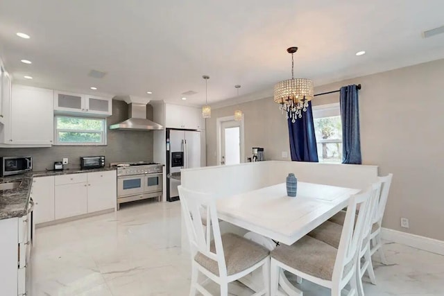 1760 Bel Air Ave, Lauderdale By The Sea, FL 33062 - dining space featuring light marble finish floors, plenty of natural light, recessed lighting, and a chandelier