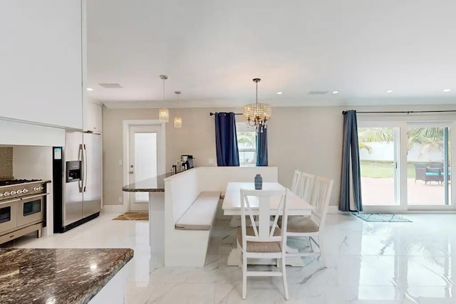 1760 Bel Air Ave, Lauderdale By The Sea, FL 33062 - dining space featuring plenty of natural light, a chandelier, recessed lighting, and light marble finish floors