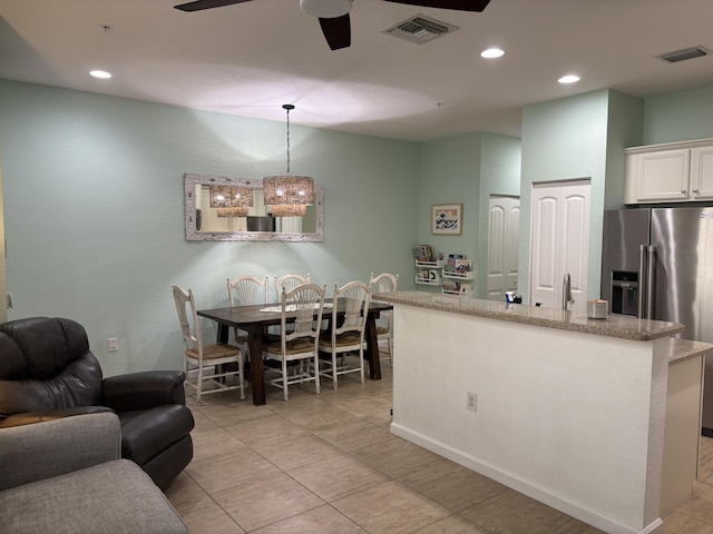 275 SW 7th Ct, Pompano Beach, FL 33060 - kitchen featuring high quality fridge, a ceiling fan, white cabinetry, recessed lighting, and light tile patterned floors