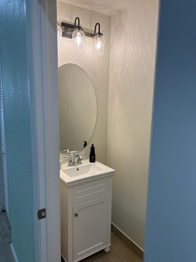 275 SW 7th Ct, Pompano Beach, FL 33060 - bathroom with vanity and baseboards
