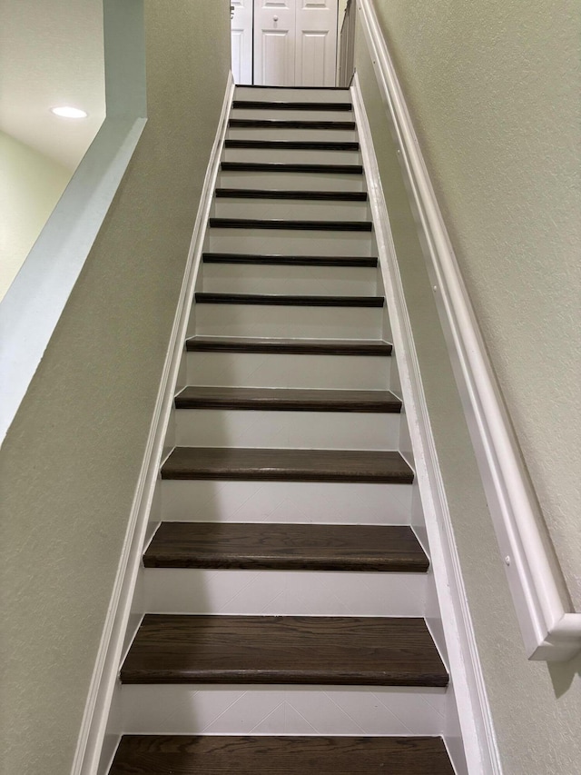 275 SW 7th Ct, Pompano Beach, FL 33060 - stairway featuring a textured wall and wood finished floors