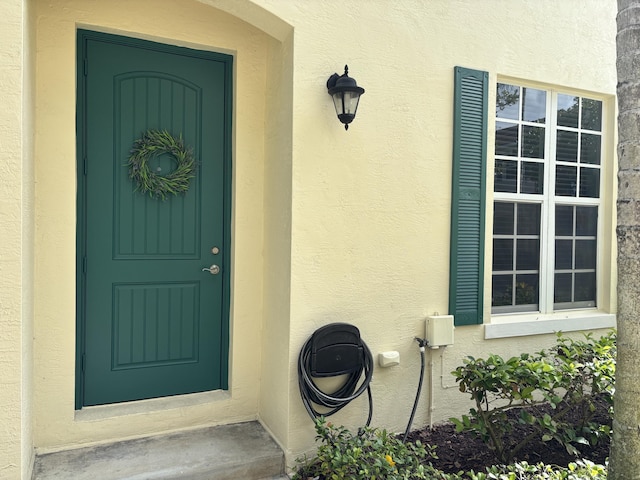 275 SW 7th Ct, Pompano Beach, FL 33060 - doorway to property featuring stucco siding
