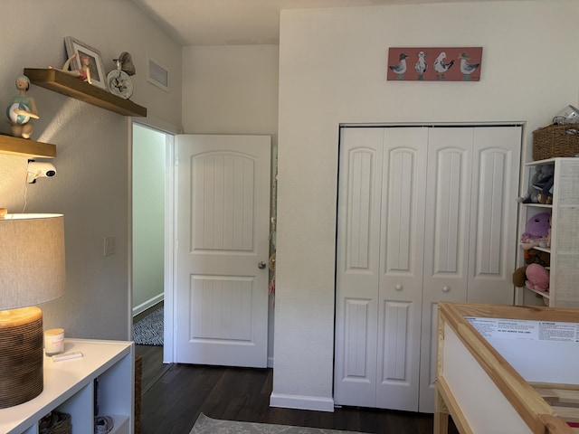 275 SW 7th Ct, Pompano Beach, FL 33060 - bedroom featuring dark wood-style flooring, a closet, and baseboards