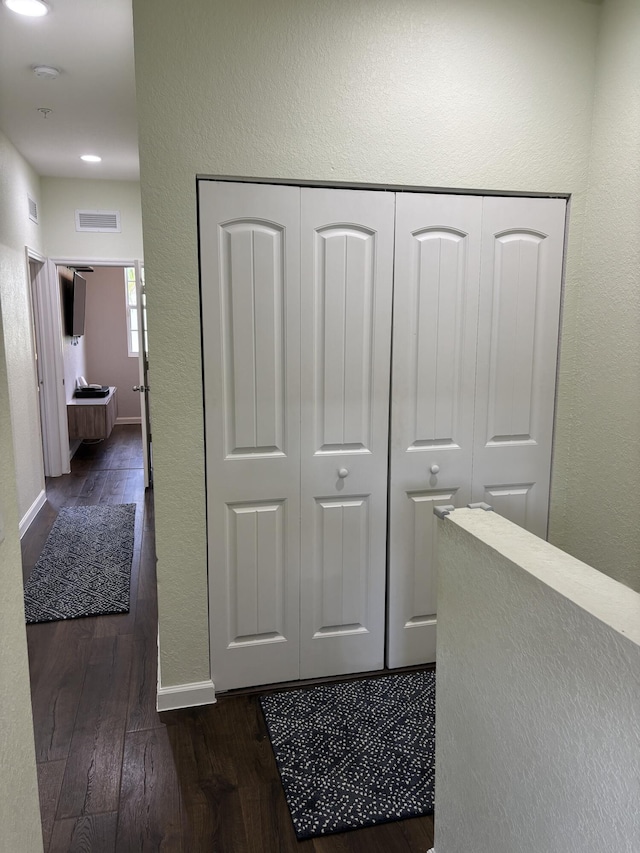 275 SW 7th Ct, Pompano Beach, FL 33060 - hall featuring dark wood-style floors, baseboards, a textured wall, and recessed lighting
