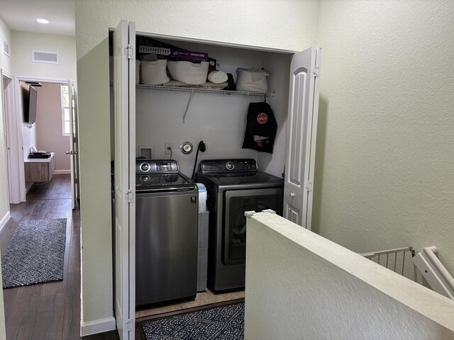 275 SW 7th Ct, Pompano Beach, FL 33060 - laundry area featuring washer and dryer, a textured wall, wood finished floors, and baseboards