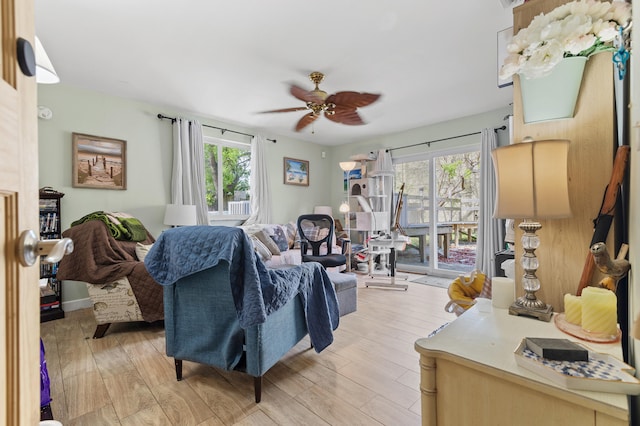 933 S Ridge St, Lake Worth Beach, FL 33460 - living room with healthy amount of natural light, ceiling fan, and light wood-style floors