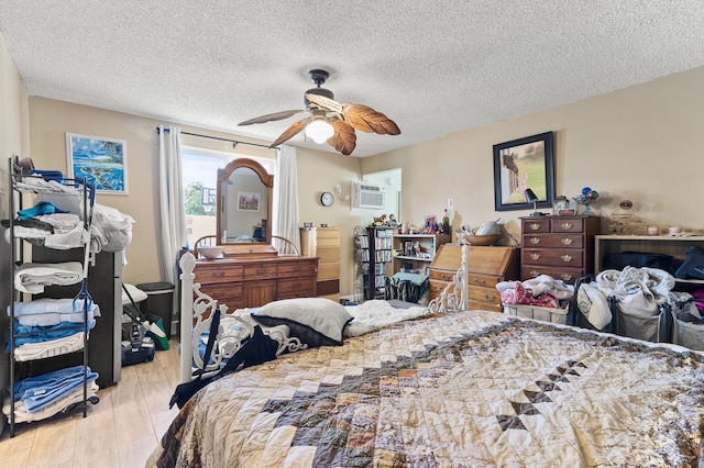 933 S Ridge St, Lake Worth Beach, FL 33460 - bedroom featuring a textured ceiling, wood finished floors, and ceiling fan