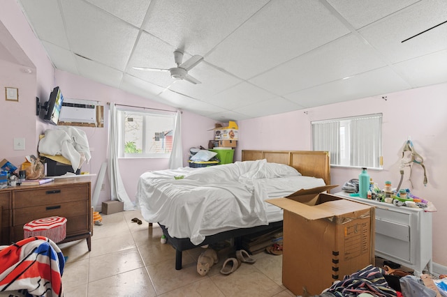 933 S Ridge St, Lake Worth Beach, FL 33460 - bedroom featuring multiple windows, lofted ceiling, a ceiling fan, light tile patterned flooring, and a paneled ceiling