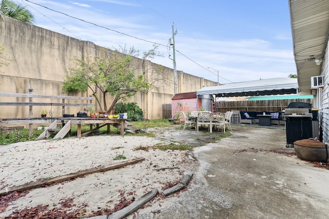 933 S Ridge St, Lake Worth Beach, FL 33460 - fenced backyard featuring a patio, an outbuilding, a storage unit, and an outdoor living space