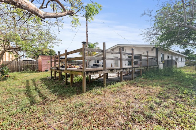933 S Ridge St, Lake Worth Beach, FL 33460 - view of yard with an outdoor structure, fence, a shed, and a wooden deck