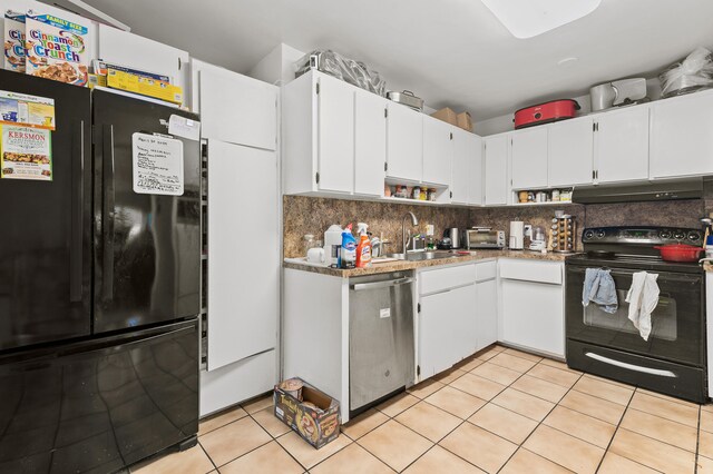 933 S Ridge St, Lake Worth Beach, FL 33460 - kitchen with black appliances, a sink, under cabinet range hood, and white cabinetry