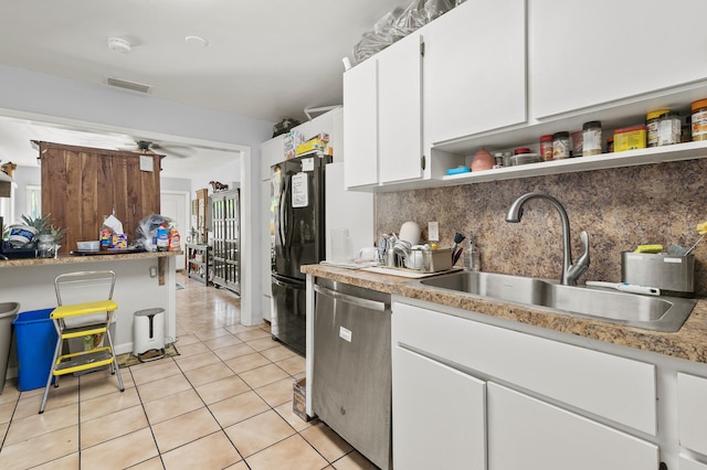 933 S Ridge St, Lake Worth Beach, FL 33460 - kitchen featuring stainless steel dishwasher, a sink, open shelves, white cabinetry, and decorative backsplash