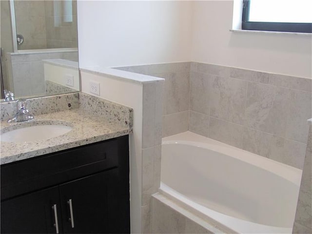 13007 Anthorne Ln, Boynton Beach, FL 33436 - bathroom with a bath, vanity, and a tile shower