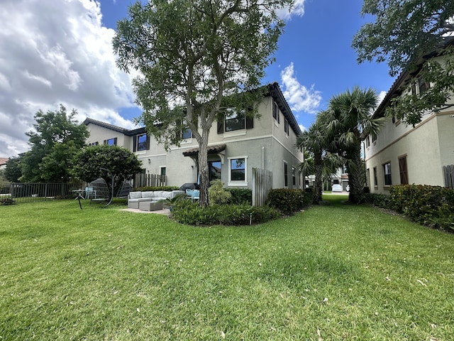 13007 Anthorne Ln, Boynton Beach, FL 33436 - back of house featuring an outdoor hangout area and stucco siding