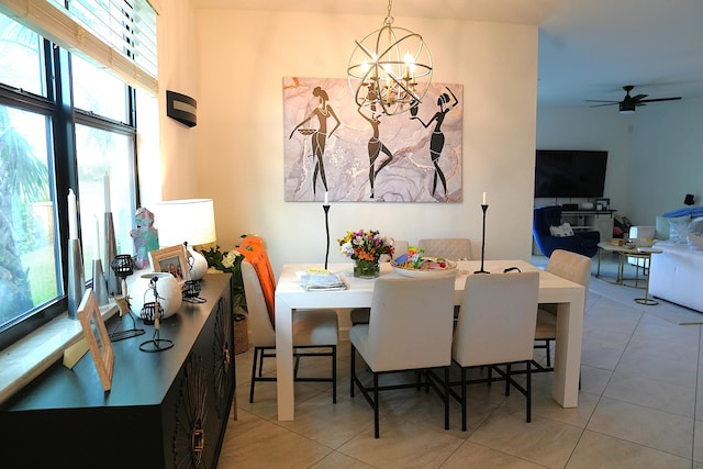 13007 Anthorne Ln, Boynton Beach, FL 33436 - dining room with healthy amount of natural light, a chandelier, and light tile patterned flooring