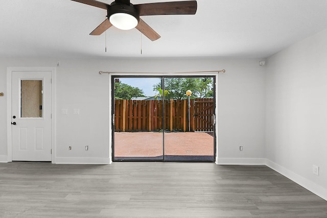 1402 Nebraska Ave Unit 3B, Fort Pierce, FL 34950 - unfurnished room with healthy amount of natural light, wood finished floors, and baseboards