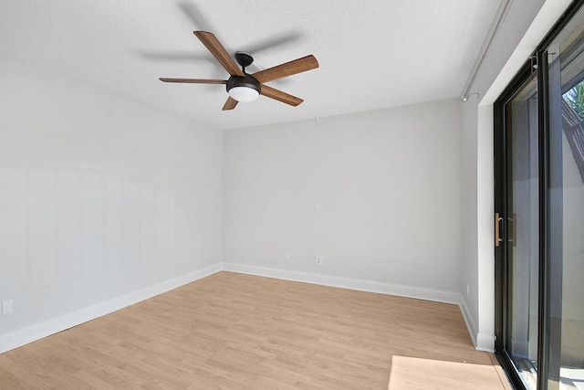 1402 Nebraska Ave Unit 3B, Fort Pierce, FL 34950 - empty room with light wood-type flooring, a ceiling fan, a textured ceiling, and baseboards