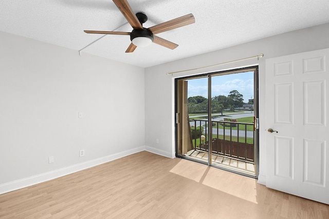 1402 Nebraska Ave Unit 3B, Fort Pierce, FL 34950 - spare room with light wood-style flooring, a ceiling fan, baseboards, and a textured ceiling