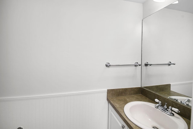 1402 Nebraska Ave Unit 3B, Fort Pierce, FL 34950 - bathroom with a wainscoted wall and vanity