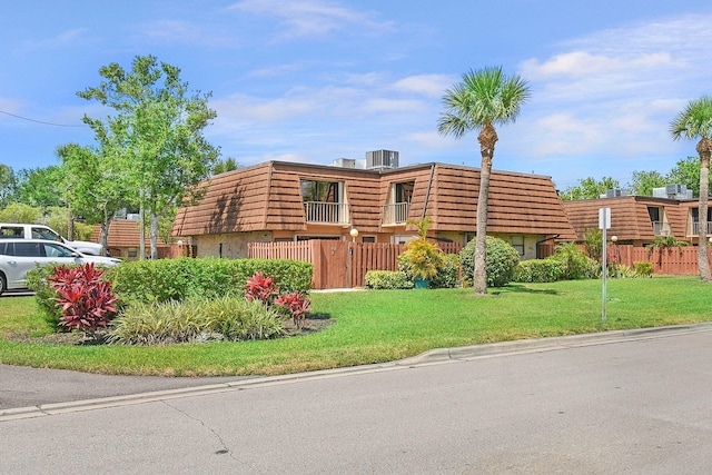 1402 Nebraska Ave Unit 3B, Fort Pierce, FL 34950 - view of front of home with mansard roof and central air condition unit