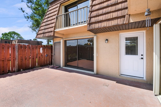 1402 Nebraska Ave Unit 3B, Fort Pierce, FL 34950 - view of patio with fence and a balcony