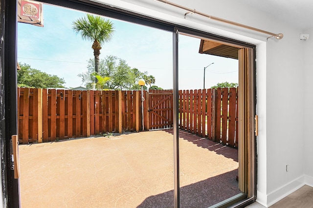 1402 Nebraska Ave Unit 3B, Fort Pierce, FL 34950 - doorway to outside with plenty of natural light and baseboards