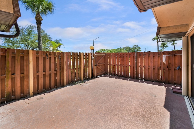 1402 Nebraska Ave Unit 3B, Fort Pierce, FL 34950 - view of patio featuring a gate and fence