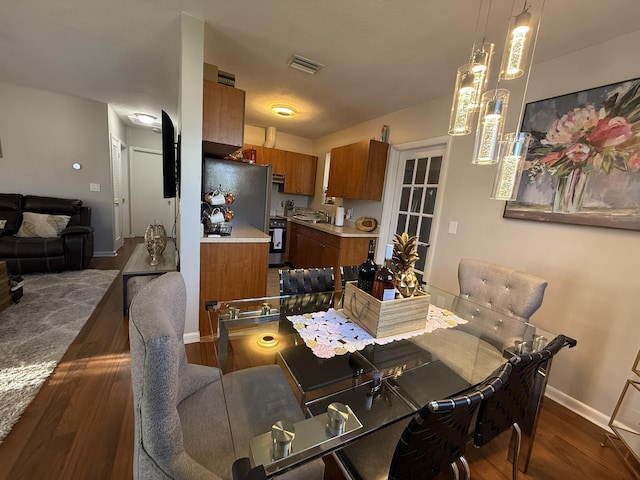 181 Morgans Way, Palm Springs, FL 33461 - dining area featuring dark wood-type flooring and baseboards