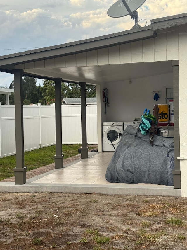 181 Morgans Way, Palm Springs, FL 33461 - view of patio / terrace featuring washer / dryer and fence