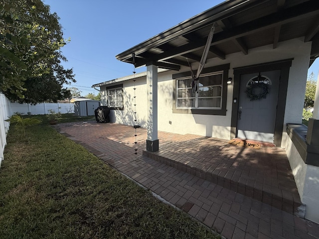 181 Morgans Way, Palm Springs, FL 33461 - view of patio / terrace with a storage unit and an outbuilding