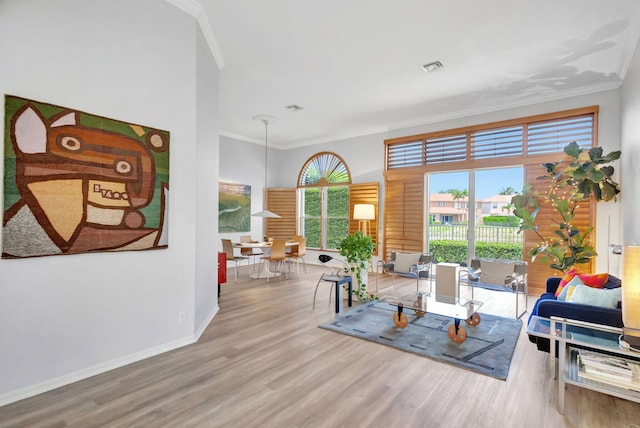 106 Sedona Way, Palm Beach Gardens, FL 33418 - sitting room with ornamental molding, wood finished floors, and baseboards