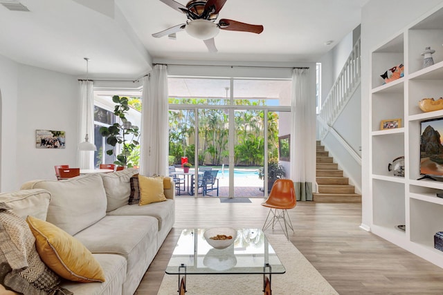 106 Sedona Way, Palm Beach Gardens, FL 33418 - living room featuring ceiling fan, wood finished floors, and stairway