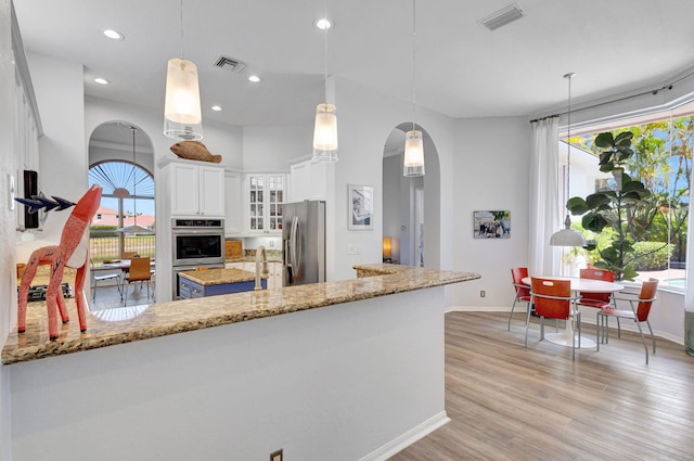 106 Sedona Way, Palm Beach Gardens, FL 33418 - kitchen with stainless steel appliances, baseboards, plenty of natural light, and recessed lighting