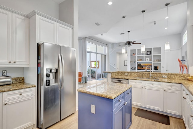 106 Sedona Way, Palm Beach Gardens, FL 33418 - kitchen featuring stainless steel appliances, a sink, light wood-type flooring, white cabinetry, and recessed lighting