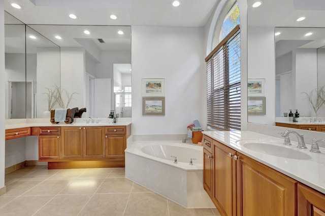 106 Sedona Way, Palm Beach Gardens, FL 33418 - bathroom featuring healthy amount of natural light, tile patterned floors, a garden tub, recessed lighting, and two vanities