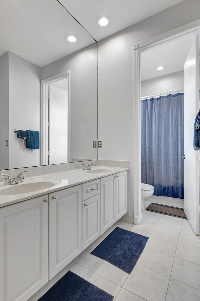 106 Sedona Way, Palm Beach Gardens, FL 33418 - full bathroom with double vanity, toilet, tile patterned flooring, a shower with shower curtain, and recessed lighting