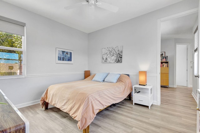 106 Sedona Way, Palm Beach Gardens, FL 33418 - bedroom with light wood-style flooring, baseboards, and a ceiling fan