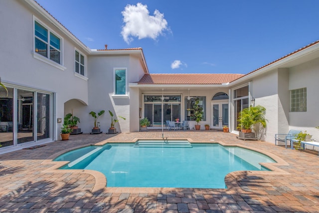 106 Sedona Way, Palm Beach Gardens, FL 33418 - outdoor pool featuring french doors and a patio area