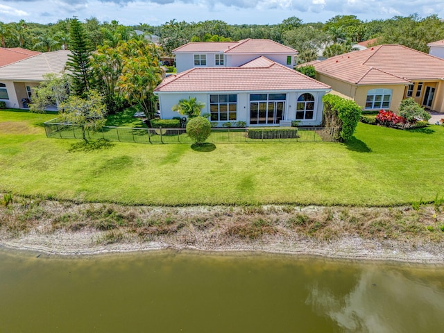 106 Sedona Way, Palm Beach Gardens, FL 33418 - rear view of house featuring a tile roof, a water view, and stucco siding