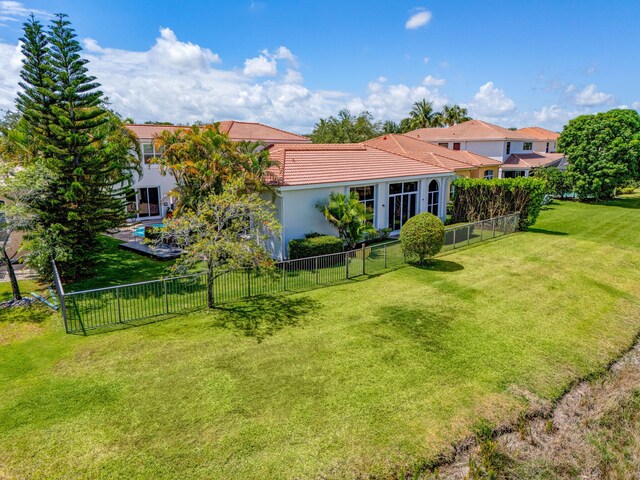 106 Sedona Way, Palm Beach Gardens, FL 33418 - mediterranean / spanish-style home featuring a tiled roof, stucco siding, driveway, and a garage