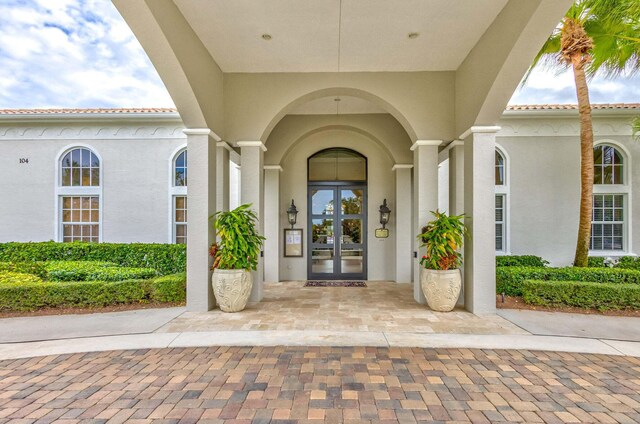 106 Sedona Way, Palm Beach Gardens, FL 33418 - rear view of house featuring a tile roof and stucco siding