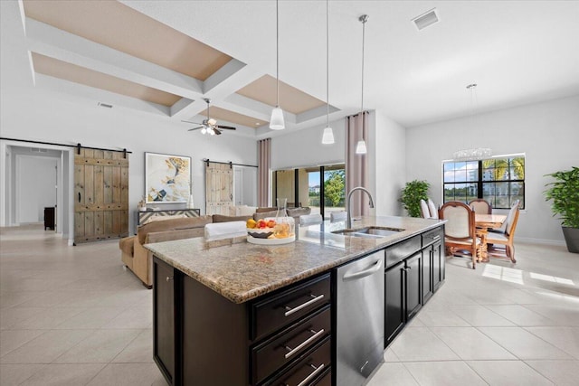 10557 Pisa Rd, Wellington, FL 33414 - kitchen with a barn door, a sink, coffered ceiling, dishwasher, and light tile patterned floors