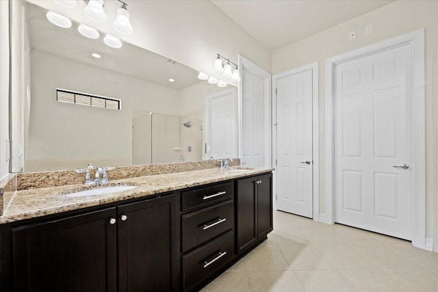 10557 Pisa Rd, Wellington, FL 33414 - full bathroom featuring a shower stall, tile patterned floors, double vanity, and baseboards