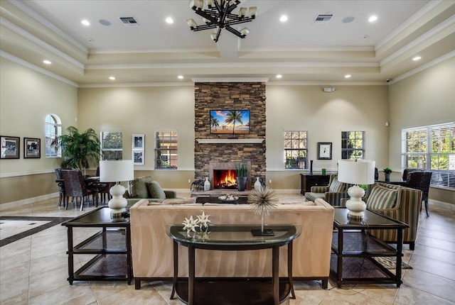 10557 Pisa Rd, Wellington, FL 33414 - living room with a towering ceiling, crown molding, a fireplace, recessed lighting, and a chandelier