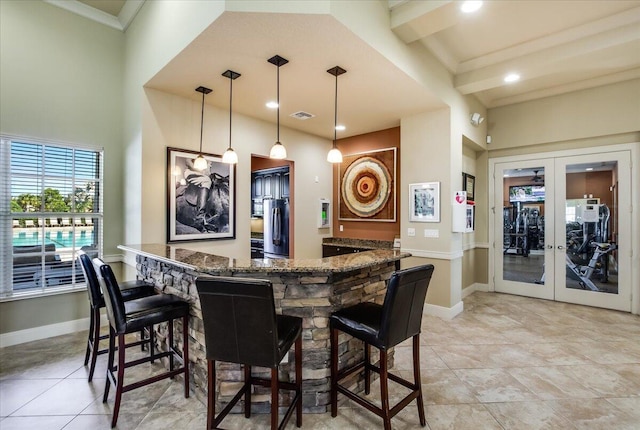 10557 Pisa Rd, Wellington, FL 33414 - community bar area with stainless steel refrigerator, french doors, baseboards, decorative light fixtures, and ornamental molding